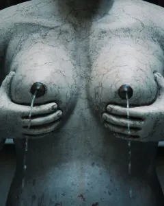 Fontana delle Tette stone sculpture with water flowing from the breasts.