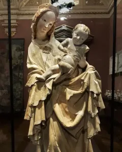 Krumlov Madonna sculpture of a woman cradling a child, with flowing carved drapery