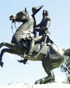 Andrew Jackson statue on a rearing horse against a blue sky