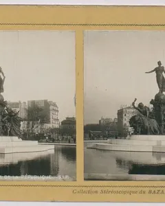 The Triumph of the Republic monument with a female figure atop a globe, surrounded by allegorical figures and lions in a shallow basin.