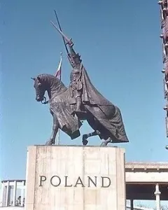 King Jagiello Monument, an equestrian bronze statue of a armored figure holding a sword aloft, with a Polish flag behind it and the word POLAND on the pedestal.