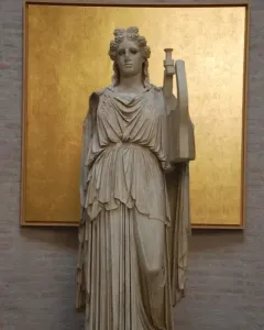Apollo Barberini marble statue standing in a flowing robe and holding a lyre