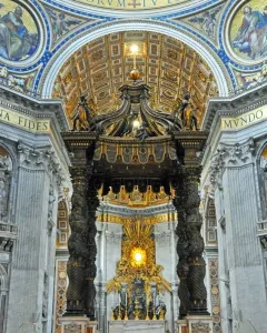 St. Peter\'s Baldachin with dark bronze spiraling columns and an ornate canopy beneath the basilica dome.