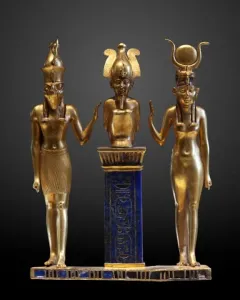 Osorkon II Triad showing three golden figures on a blue hieroglyphic pillar.