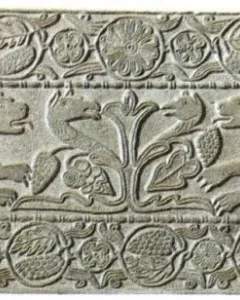 Plutei of Theodota carved stone relief with winged lion-like creatures flanking a central plant motif and surrounded by ornate decorative borders.
