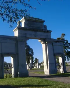 Confederate Memorial Gateway stone entrance with vehicle and pedestrian arches in a cemetery