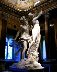 Bernini’s Apollo and Daphne marble sculpture showing Apollo lunging toward Daphne as she transforms into a tree.