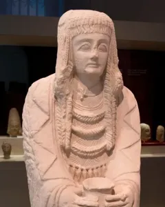 Lady of Cerro de los Santos statue holding a small vessel at chest level
