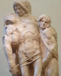 Palestrina Pietà, a partially carved marble sculpture of three figures with a central draped body supported by two others.