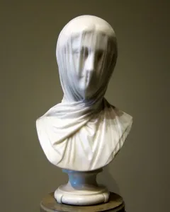 The Veiled Nun marble bust with a translucent veil draped over the woman’s face and shoulders.