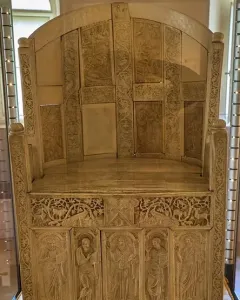 Throne of Maximian, an ornate ivory throne with carved panels of robed figures and decorative animal motifs.