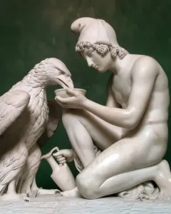 Ganymede with Jupiter\'s Eagle marble sculpture of a kneeling young man offering a dish to an eagle.