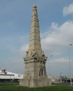 Titanic Engine Room Heroes Memorial stone monument with carved figures and a flame-like top