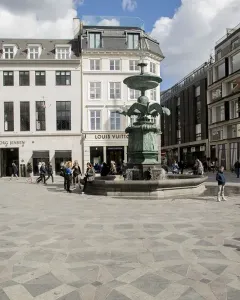 Stork Fountain with green-patinaed bird figures in a Copenhagen city square