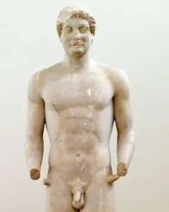 Aristodikos Kouros, a nude marble male statue with missing forearms, standing on a base.