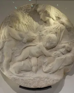 Taddei Tondo marble relief showing the Virgin and two children