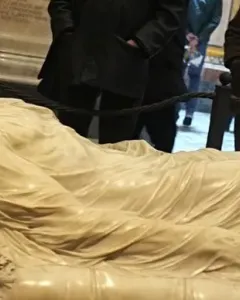 The Veiled Christ marble sculpture showing a reclining figure covered by a finely carved translucent-looking veil.