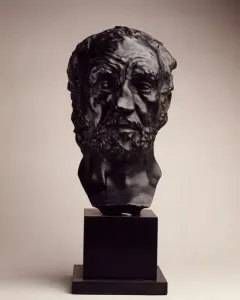 Bust of Man with the Broken Nose showing an older bearded man with a flattened nose on a dark pedestal.