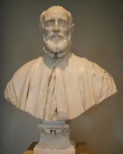 White marble bust of Francesco Barberini with a beard, mustache, and draped cape on a pedestal.