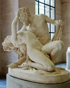 Satyre et bacchante marble sculpture showing two intertwined figures in a museum hall