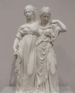 Princesses Monument showing two white classical women in flowing gowns standing together on a base.