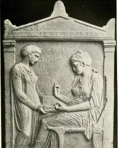 Grave Stele of Hegeso showing two draped women in relief, one standing and one seated with an open box.