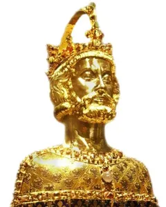 Golden bust of Charlemagne with a crown, beard, and ornate jewel-like decoration.