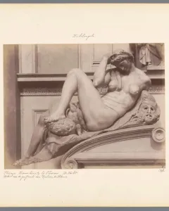Michelangelo’s Night, a reclining nude marble figure with an owl and mask on the base.