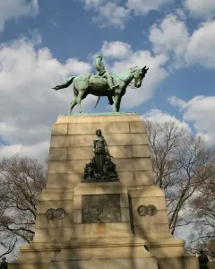Sherman Monument with a bronze equestrian statue on a tall stone pedestal, flanked by sculptural figures and relief panels.