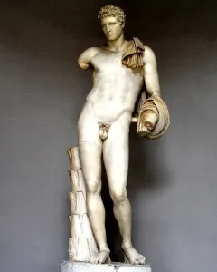 Hermes Belvedere, a white marble nude male statue with short curly hair, a draped cloth over one shoulder, and a missing left forearm.