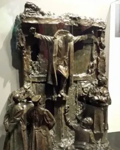 Canada\'s Golgotha bronze sculpture showing a central figure with outstretched arms above several uniformed figures looking up