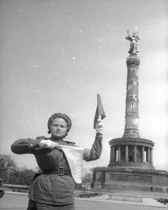 Victory Column with a winged figure holding a wreath and staff atop a fluted column.