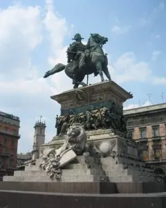 Victor Emmanuel II Monument with an equestrian statue on a marble pedestal and a lion sculpture at the base