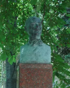 Tudor Arghezi bust on a red granite pedestal in the Alley of Classics