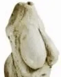 Venus of Moravany figurine with a rounded torso, prominent breasts, and no visible head or limbs.