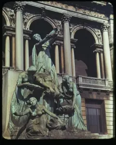 Fountain of the Great Lakes with bronze draped figures surrounding a cascading water vessel.