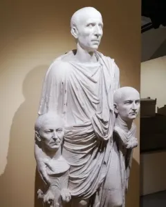 Togatus Barberini, a white marble statue of a man in a toga holding two portrait busts.
