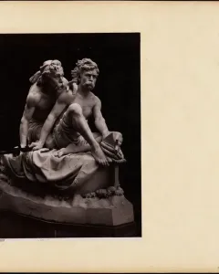 Kanaris at Chios marble sculpture showing two muscular, bare-chested men, one seated with a coiled rope and nautical tool while the other leans over his shoulder