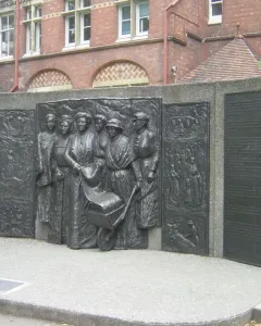 Kate Sheppard National Memorial bronze relief with plaques beside a brick building
