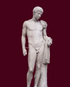 Hermes of Aegium, a light-colored marble statue of a nude male figure with a draped cloth over one shoulder and arm, standing against a dark red background.