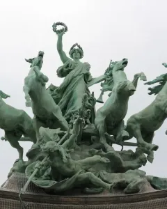Immortality Overtaking Time sculpture with a female figure raising a wreath above a chariot pulled by four horses