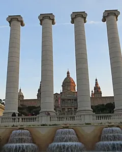 The Four Columns standing before a domed building and fountain