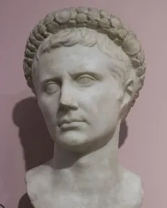White marble bust of Augustus wearing a gemmed crown.
