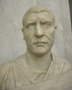 White marble bust of Philip the Arab with short textured hair and a serious expression.