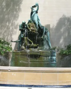 Fountain of the Great Lakes with bronze draped figures surrounding a cascading water vessel.