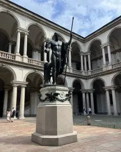Napoleon as Mars the Peacemaker, a bronze nude statue on a hexagonal pedestal in the Brera courtyard.