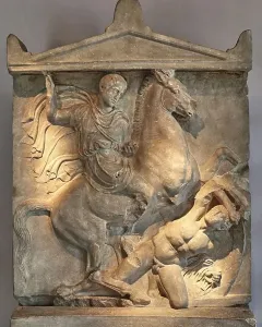 Stele of Dexileus showing a cloaked rider on a rearing horse above a fallen figure, with an inscribed stone base below.