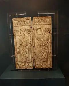 Diptych of Boethius with two carved ivory panels showing robed male figures holding staffs.