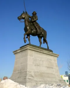 Tadeusz Kościuszko Monument showing a bronze equestrian statue of a man in military attire with a raised sword on a stone pedestal.