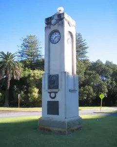 Edith Cowan Memorial stone clock tower with a bronze bust and plaque.